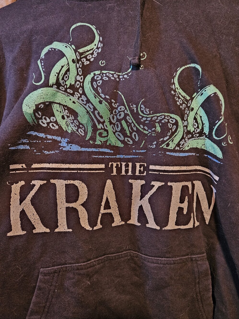 The Kraken Unisex Medium Size Hoodie Washed Out Black Color
